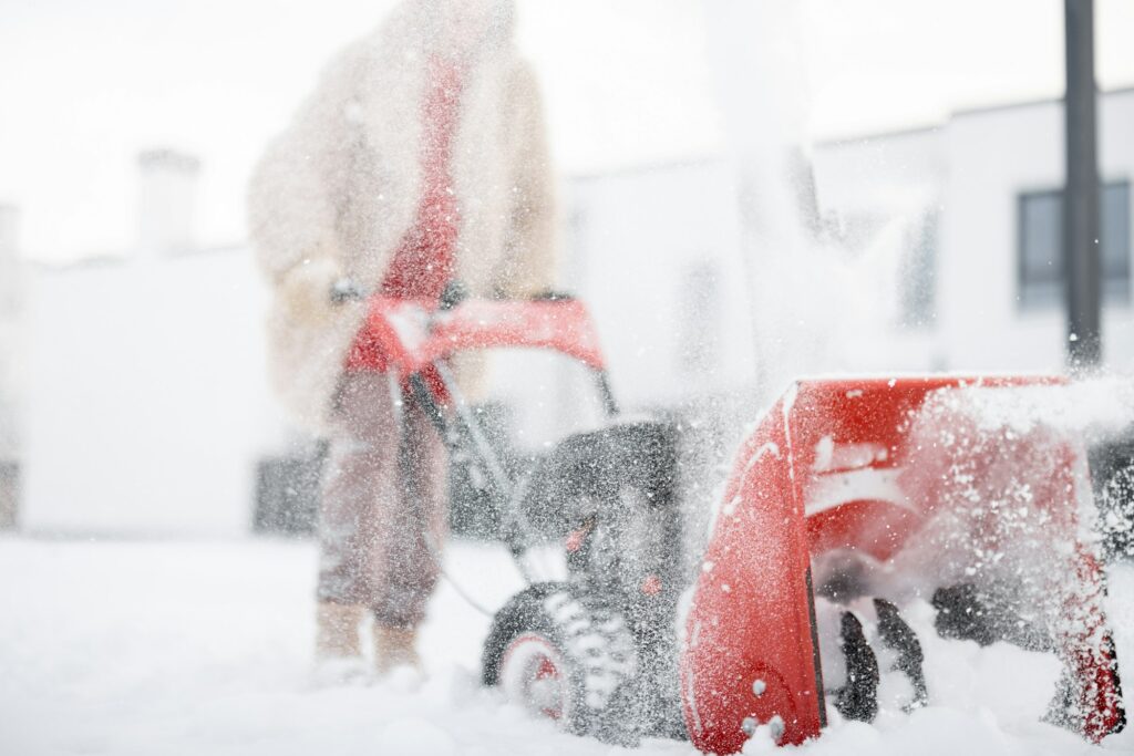 Snow thrower machine in work